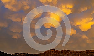 Cumulus and Stratus clouds in dramatic sunset sky over Cape Town