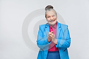 Cunning aged woman toothy smiling