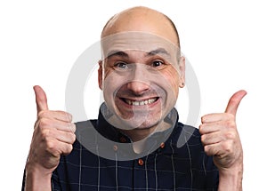 Cunning bald man showing thumbs up