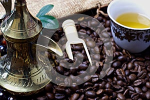 A cup of Arabian coffee  with coffee bean as background