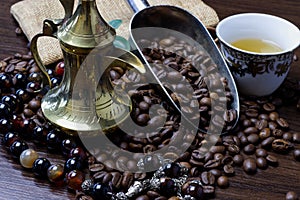 A cup of Arabian coffee  with coffee bean as background