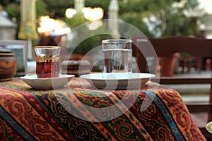 Cup of arabic tea and glass of water