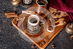 Cup of aromatic coffee drink and coffee beans on wooden background. Top view