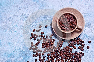 Cup of Aromatic Coffee with Grains on Light Blue Background. Top View Flat Lay. Copy Space For Your Text