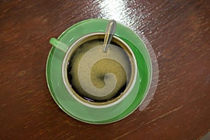 Cup of art espresso on desk
