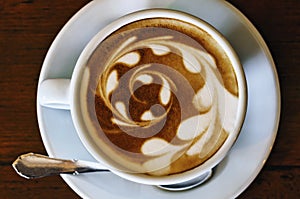 Cup of art latte or cappuccino coffee