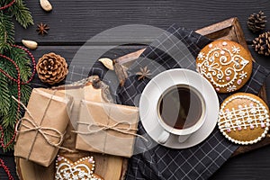 Cup of black coffee with Christmas gingerbread cookies