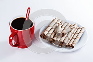 Cup of black coffee, cookies, sweet sticks