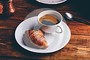 Cup of Black Coffee and Fresh Croissant