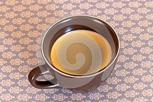 Cup of black coffee isolated on a table