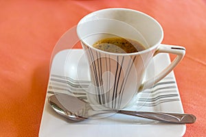 Cup with black coffee in resort Rasdhoo Atoll island Maldives