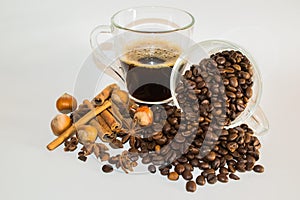 Cup of black coffee, spices and coffee beans