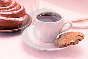 Cup of Black Coffee with a Sweet Bun and cookie