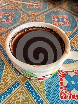 A cup of black coffee on the table ready to be sipped