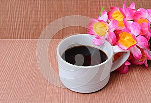 cup of black coffee on wooden background