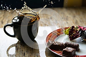 Cup of black tea on table