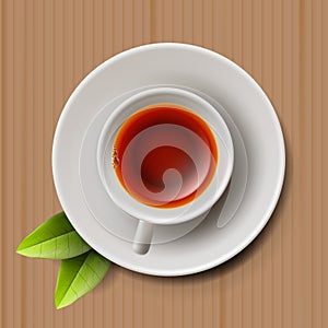 Cup of black tea, top view on cardboard