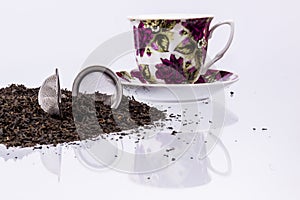 Cup and black tea on white background.