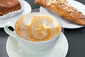 Cup of Caffe Latte with Pastry