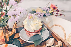 Cup Cake on beautiful wooden tray with flowers