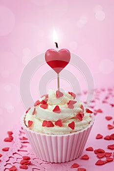 Cup cake with heart candle