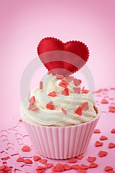 Cup cake with heart shaped decoration