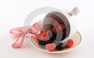 The cup with candy and pink bow