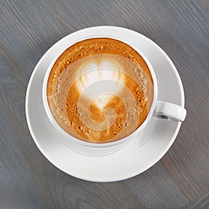 Cup of cappuccino coffee with heart
