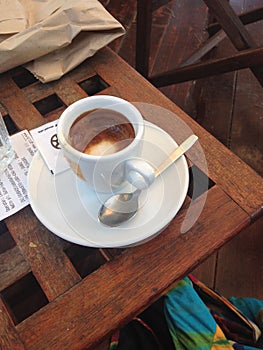Cup of cappuccino on a wooden table in a cafe