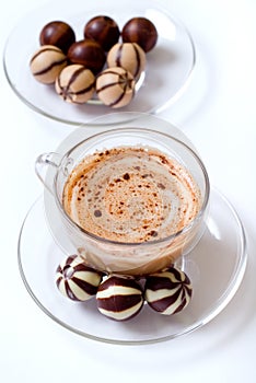 Cup of cappucino and candies