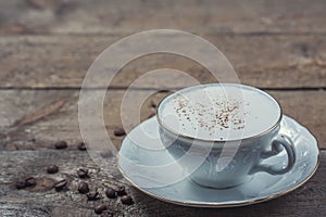A cup of Capuchino coffee in a white cup