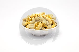 A cup of cashew nuts on white background