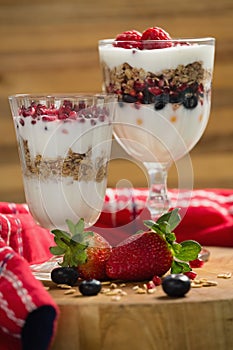 Cup of cereals with fruits and yogurt