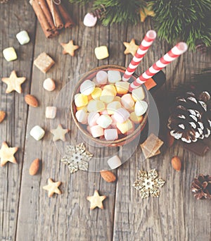 Cup of Christmas hot cocoa with marshmallow, top view, selective focus