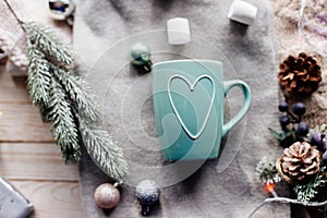 Cup of cocoa with marshmallows on table.