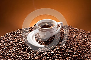 A cup and coffe beans photo