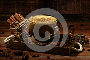 Cup of coffe Cappuccino  with milk on a dark background. Hot coffe ,latte or Cappuccino prepared with milk on a wooden table with