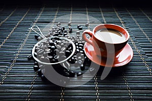 Cup of coffe with coffee beans