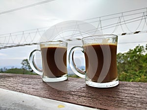 a cup of coffe on the wood table