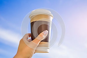 Cup of coffee against the blue sky