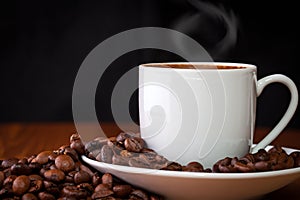 Cup of coffee against dark background