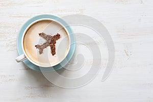 Cup of coffee with aircraft (airplane made of cinnamon)