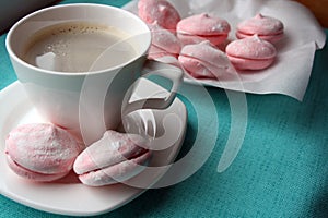 A cup of coffee and an airy apple marshmallow made according to the recipe