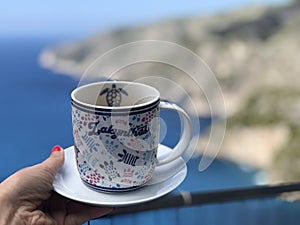 a cup of coffee on the background of the ionian sea in greece on the island zakynthos