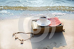 Cup of coffee at the beach