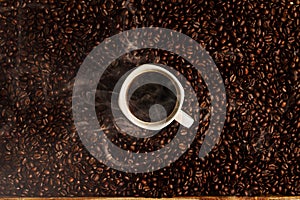 Cup of coffee on beans background