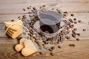 cup of coffee, beans and cookies-hearts related together