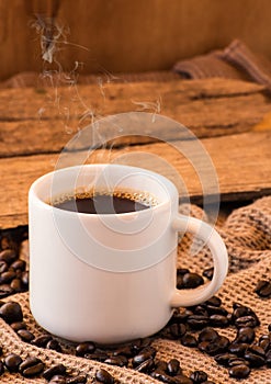 Cup of coffee with beans still life