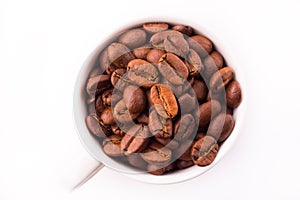 Cup with coffee beans on white background. caffeinated drink
