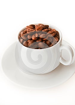 Cup with coffee beans on white background. caffeinated drink